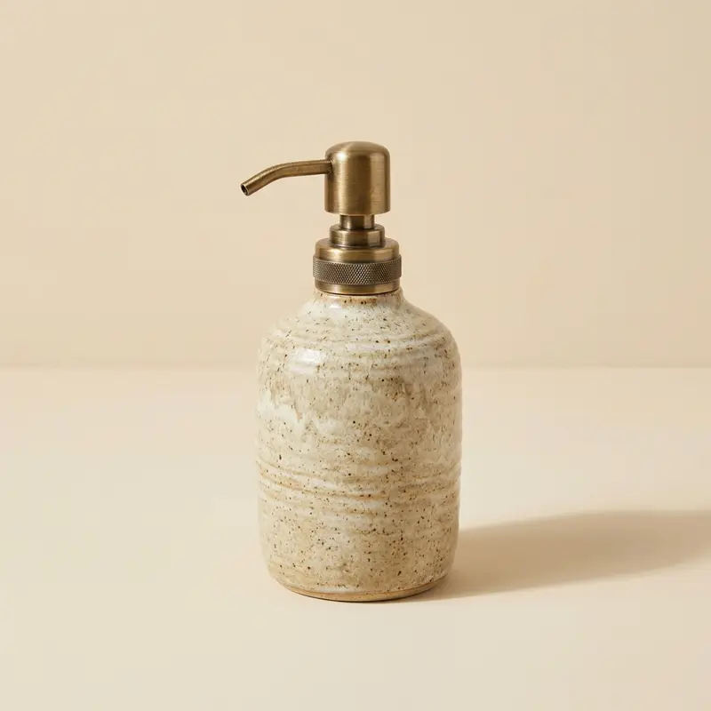 Oriel stoneware soap dispenser in Oat glaze
